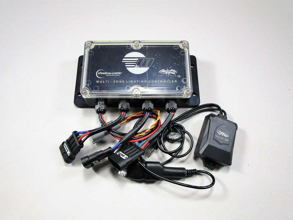 Stereo RGB control box with wiring harness and power supply, used for multi-zone lighting control in marine or automotive systems.