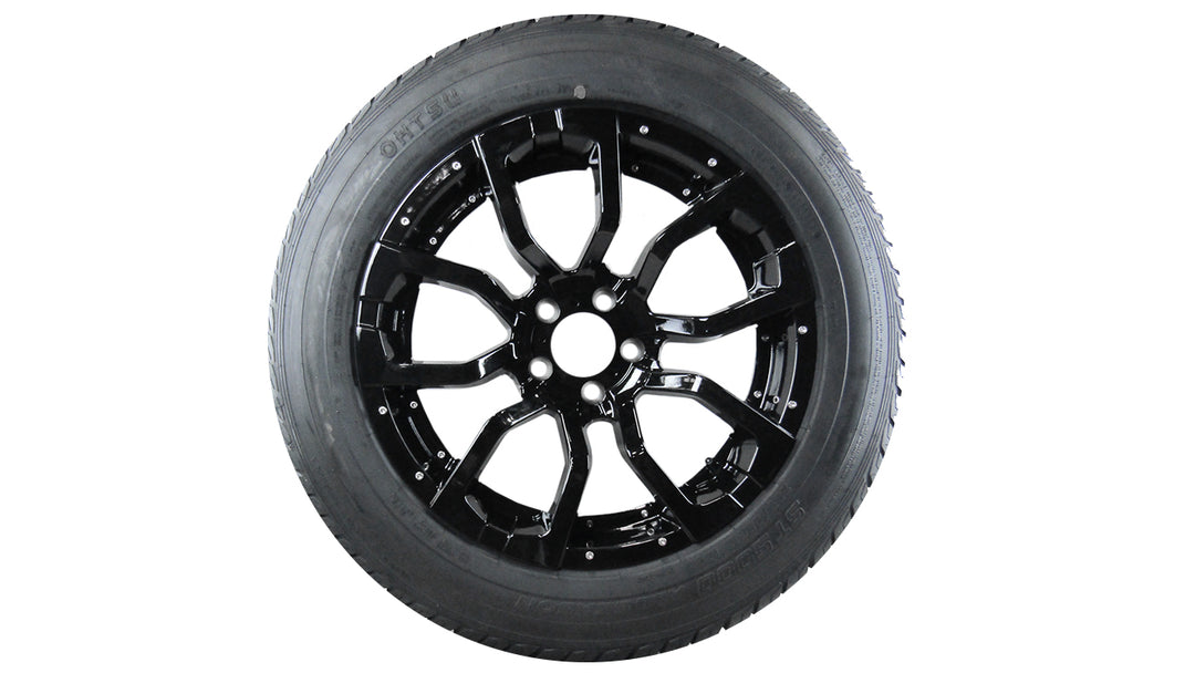 Malibu Trailer Wheel and Tire HE1818 features a sleek black wheel design with a durable tire for optimal performance.
