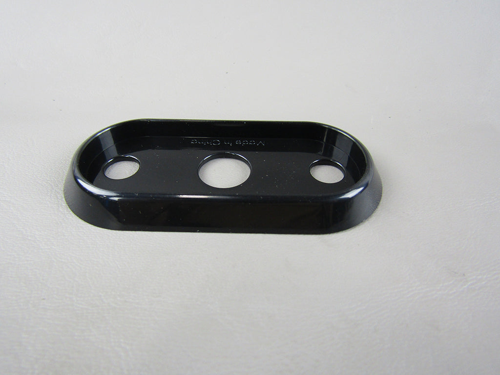 Black Malibu/Axis trailer clearance light bezel with three circular holes for mounting lights.