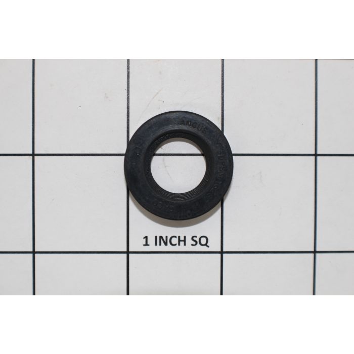 Indmar raw water pump seal, small black rubber gasket with inner threading, shown on a grid with 1-inch squares for size reference.