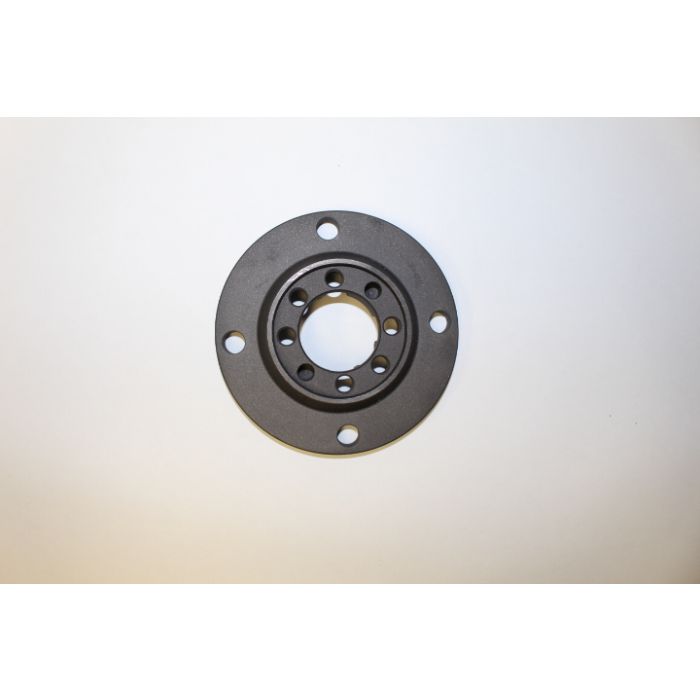 Indmar Flange Output V Thru, a circular metal flange with multiple bolt holes, used for connecting marine engine components.