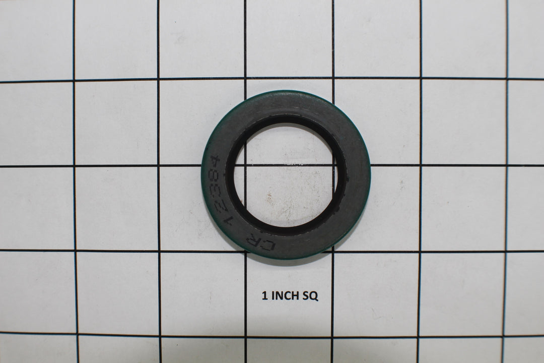 Input seal for Malibu and Axis boats, featuring a circular design with a black rubber center and green outer ring.