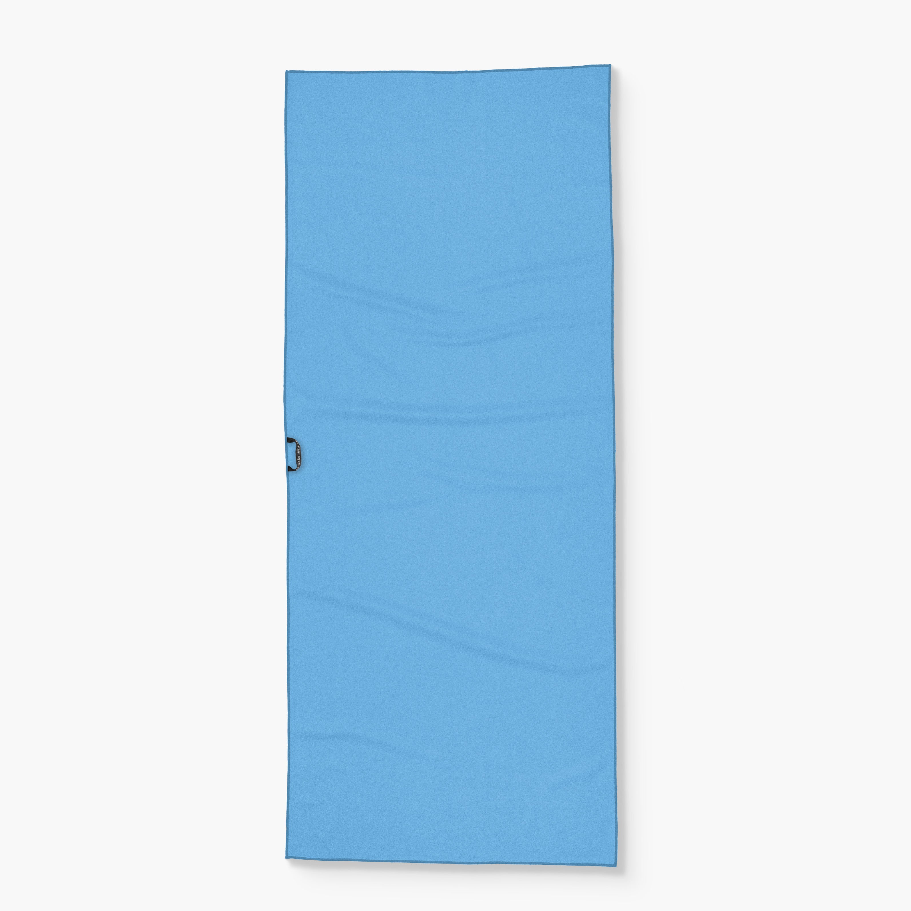 Blue sleeping mat with a handle, labeled "Wake Head - Canyon Dreams," designed for outdoor or camping use.