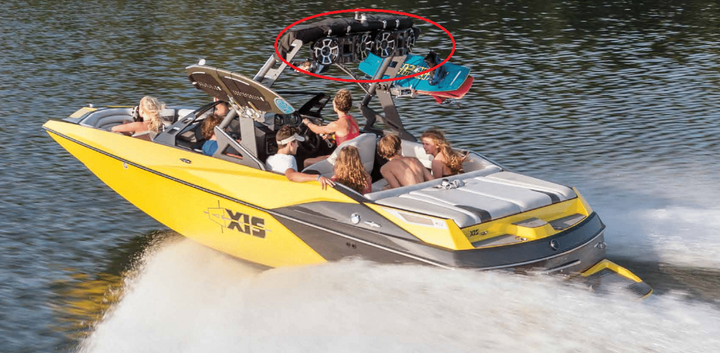 Dual 10-inch black tower speakers mounted on a boat, enhancing the audio experience for passengers enjoying a day on the water.