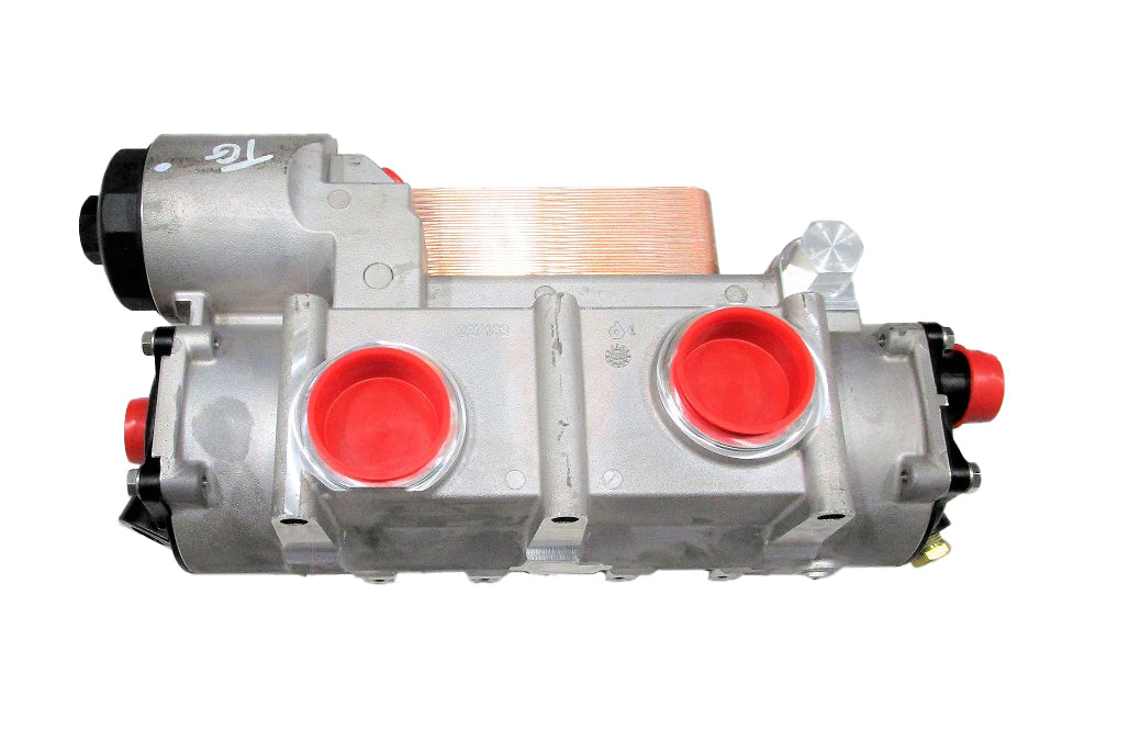 Heat Exchanger - Short Filter Gen V component with metal body and red inlet/outlet ports, used for industrial filtration.