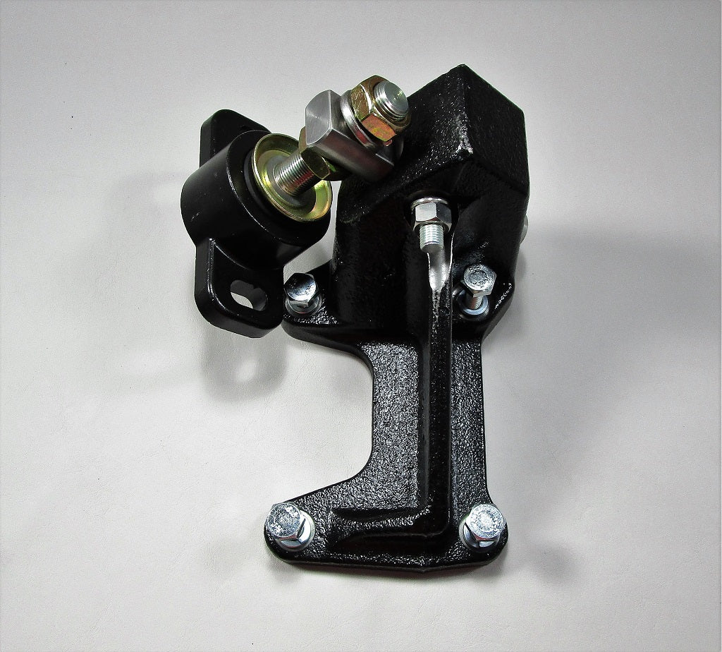 Right side engine mount with black metal bracket and rubber isolator, used to secure the engine in a vehicle.