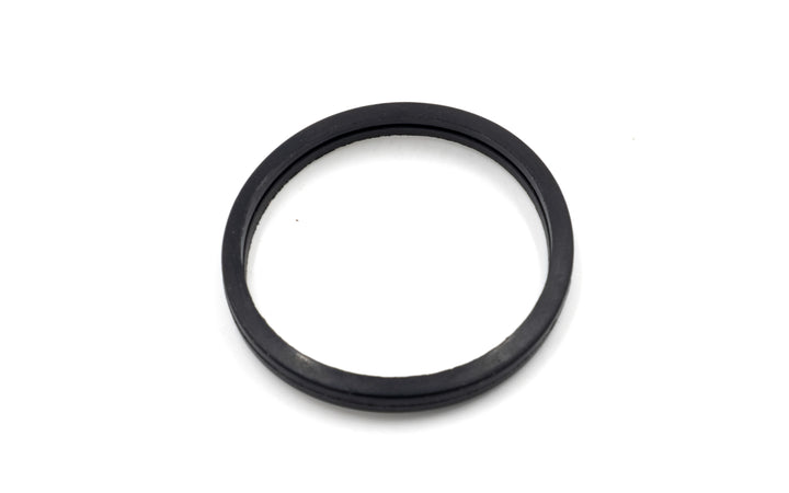 Black exhaust elbow gasket for M-Series/LT4 thermostats, designed to seal the connection and prevent leaks.