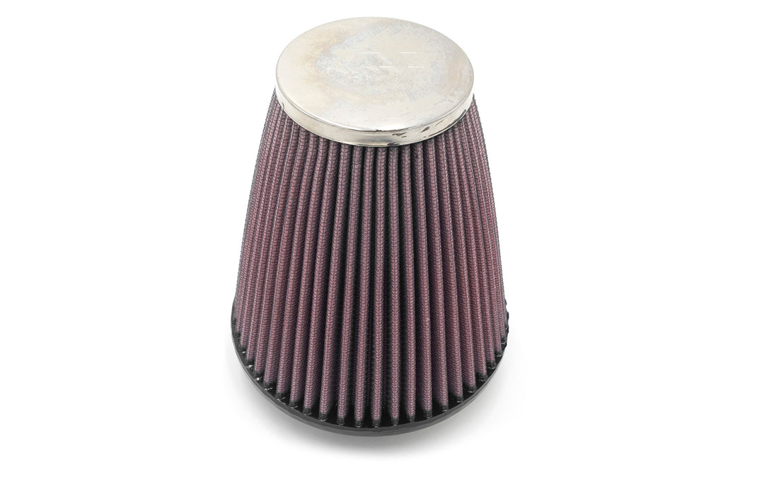 Air intake flame arrestor filter with metal top, pleated fabric filter, and black base for engine safety and performance.