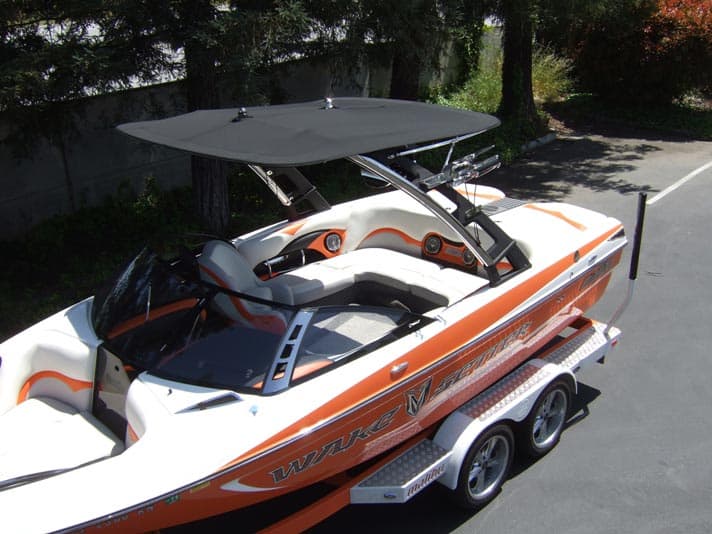 Extra large Malibu G3 complete bimini top installed on a speedboat, providing shade and sun protection.