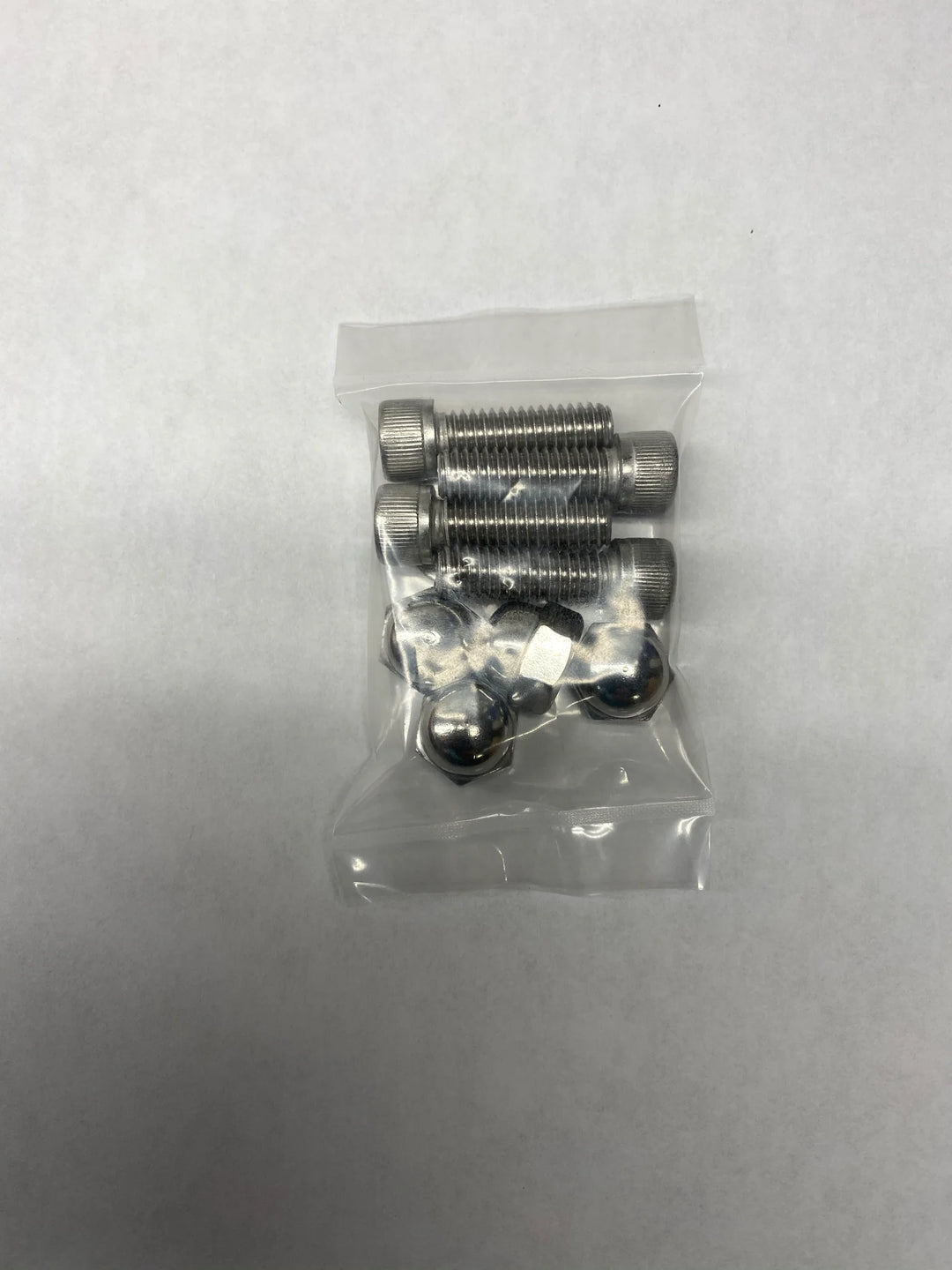 Pack of stainless steel surf tow points with bolts, nuts, and ball-shaped ends for boat or watercraft towing.