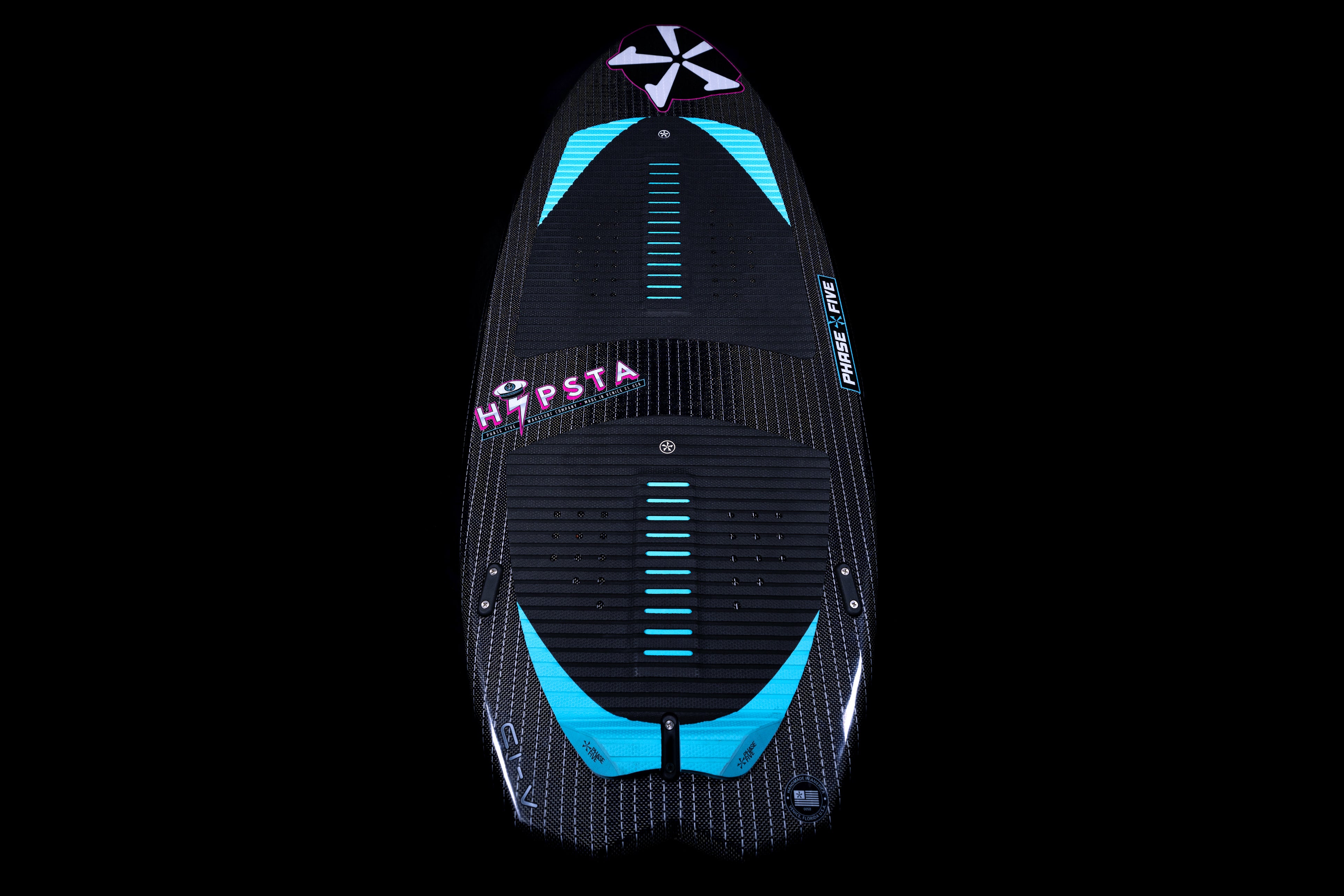 2025 Phase 5 Hypsta skim board featuring a sleek design with a black surface and turquoise accents, ideal for water sports.