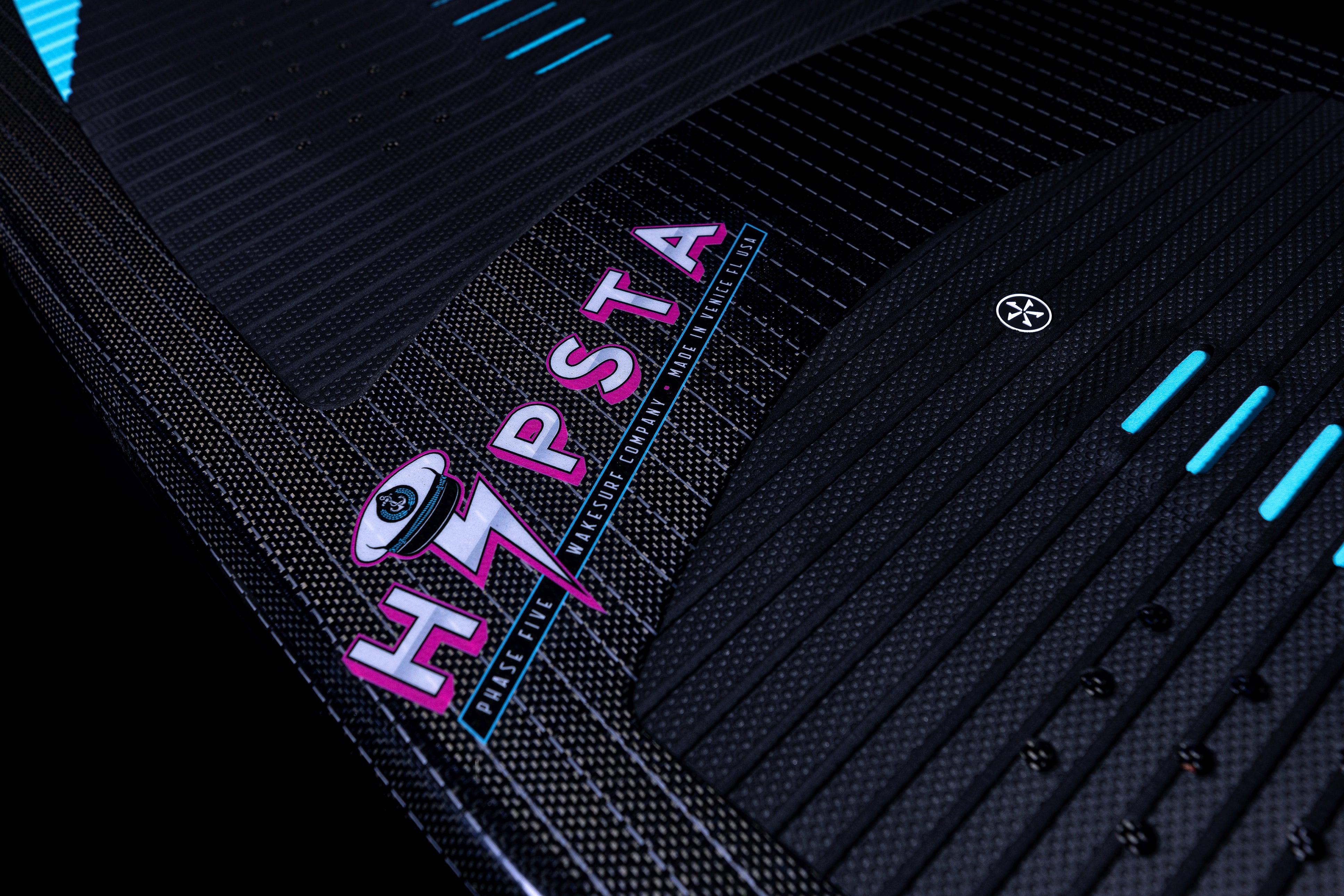 Close-up of the 2025 Phase 5 Hypsta skim board showcasing its textured surface and vibrant logo design.