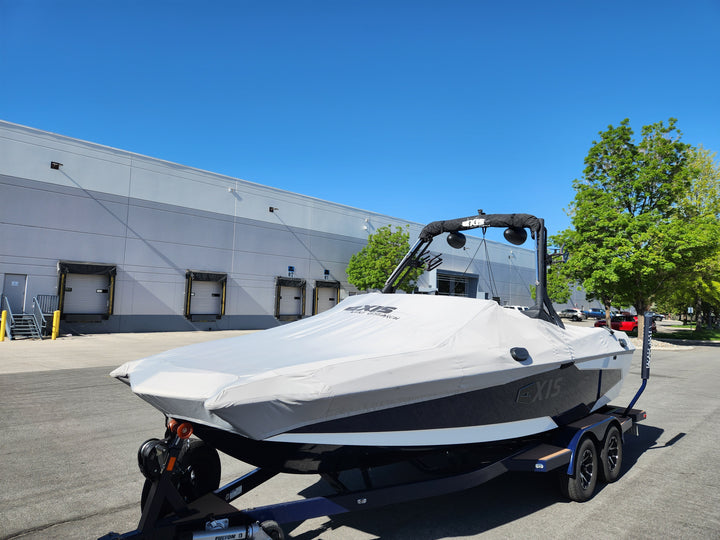 Axis A24 boat cover with GS tower and swim platform, protecting the boat from the elements while parked.