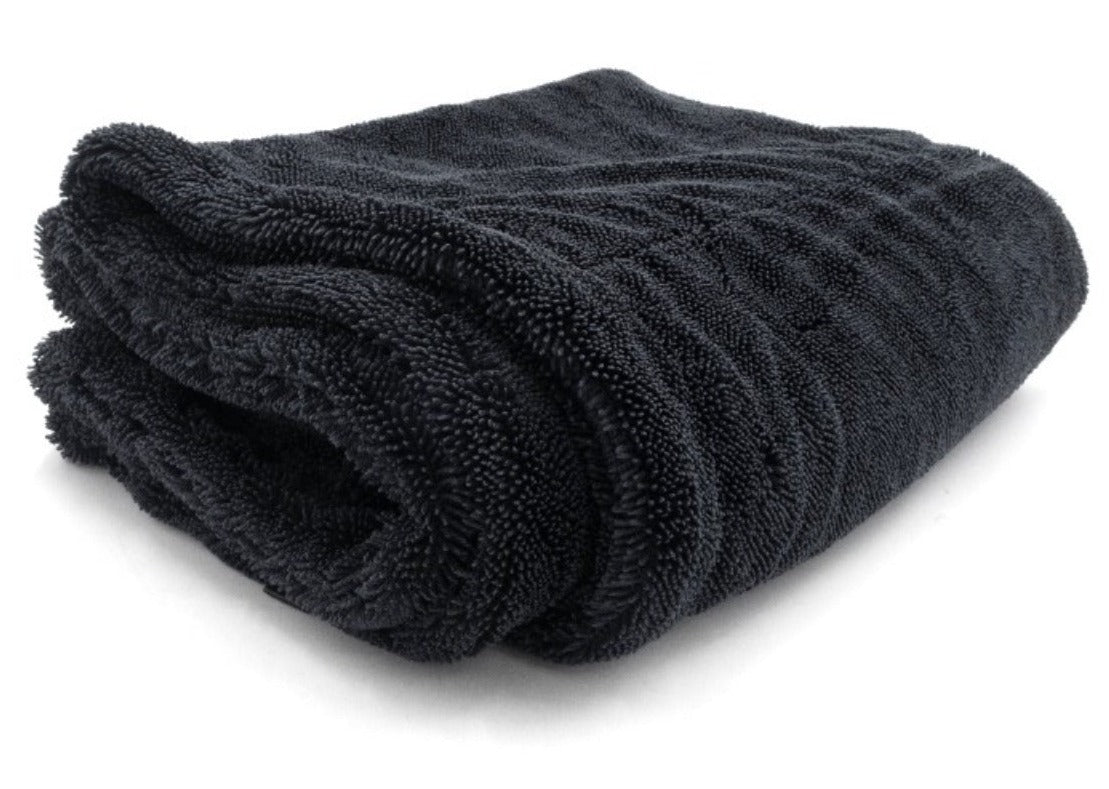 Black twisted loop drying towel, soft and absorbent microfiber material, neatly folded for quick drying and cleaning.