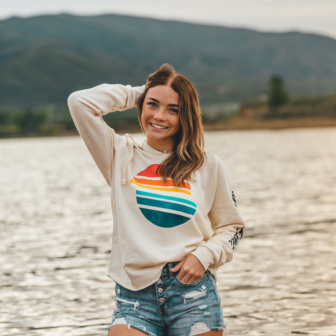 Women’s Sunsetter Pullover featuring a colorful sunset graphic, long sleeves, and a casual, relaxed fit.