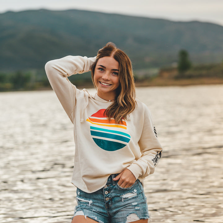 Women’s Sunsetter Pullover featuring a colorful sunset graphic, long sleeves, and a casual, relaxed fit.