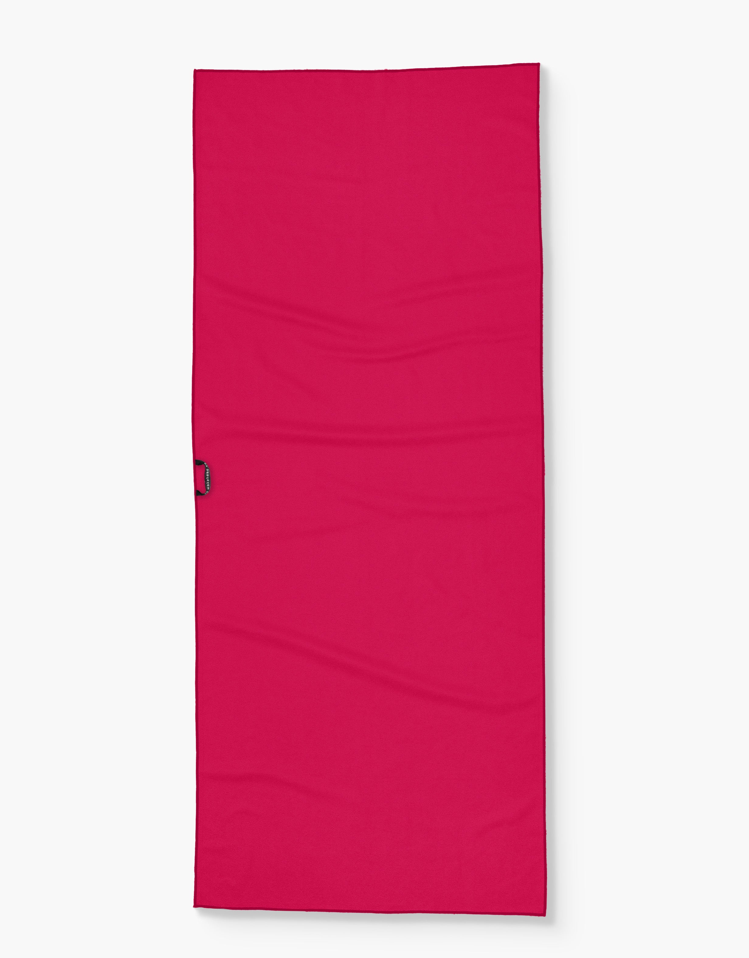 Bright pink Patriot's Lake towel with a black loop on the side, designed for outdoor use and lounging.