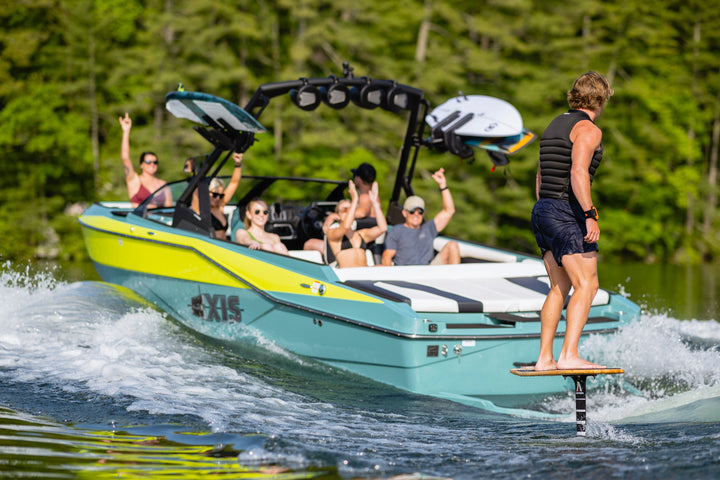 Axis AW20 Tower in black with a group of friends enjoying a day on the water, showcasing a fun boating experience.
