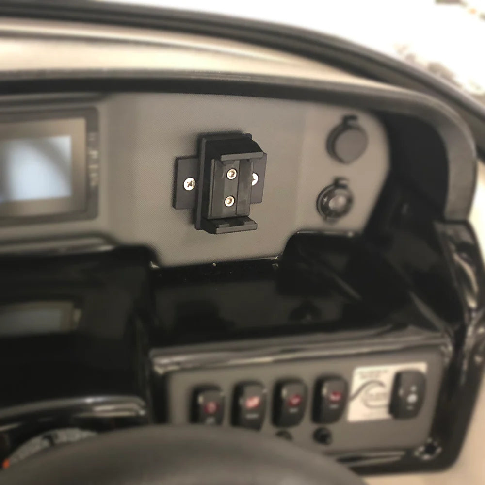 Universal rotating phone holder mounted on a vehicle dashboard, allowing adjustable and secure phone positioning.