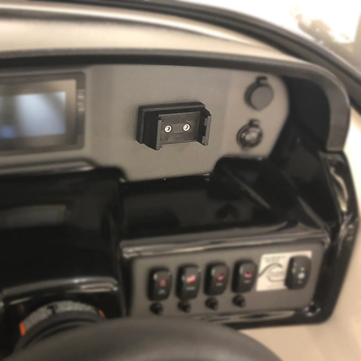 Universal rotating phone holder attached to a vehicle dashboard, allowing adjustable and secure phone positioning.