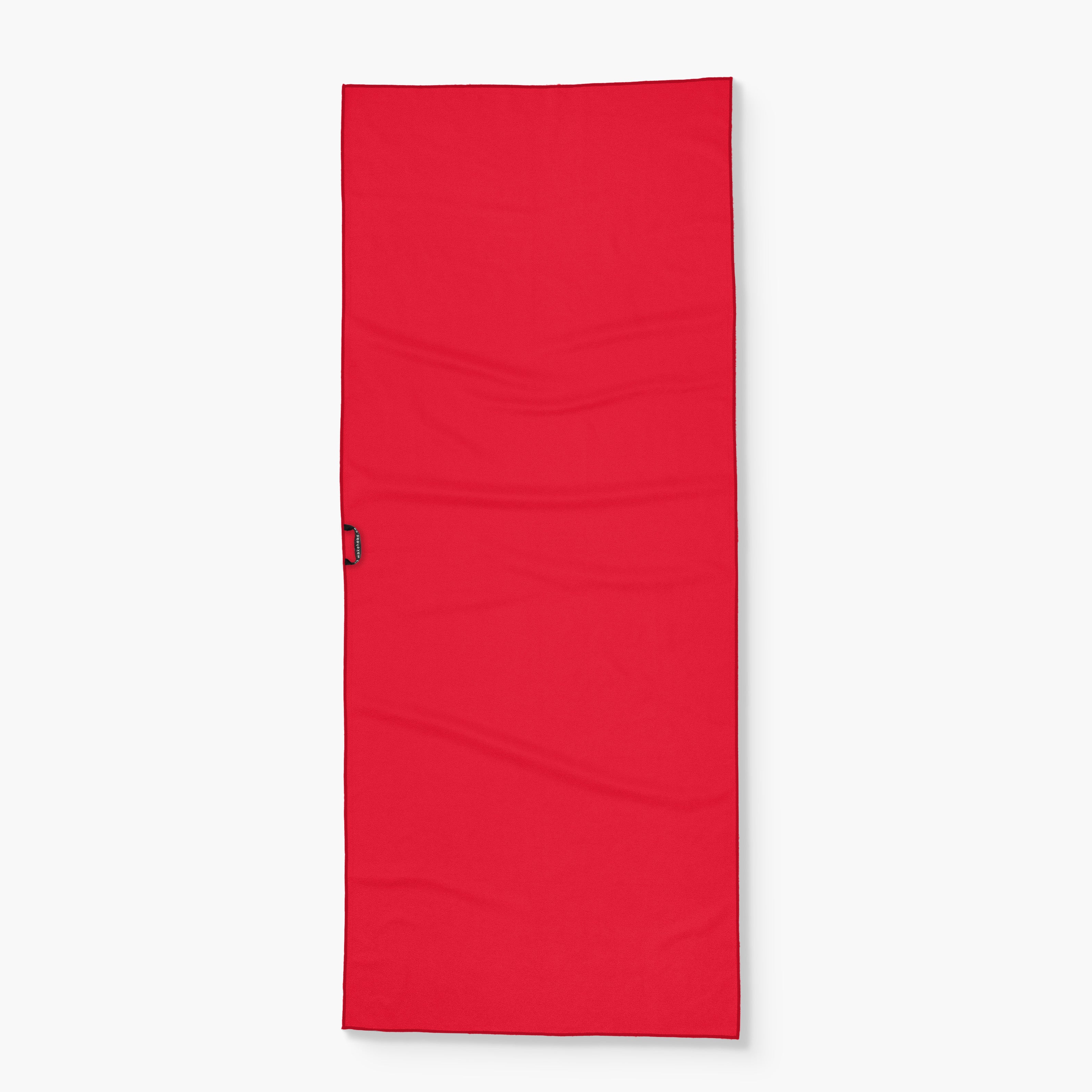 Red stars and stripes lake towel with a black hanging loop on the side, designed for outdoor and beach use.