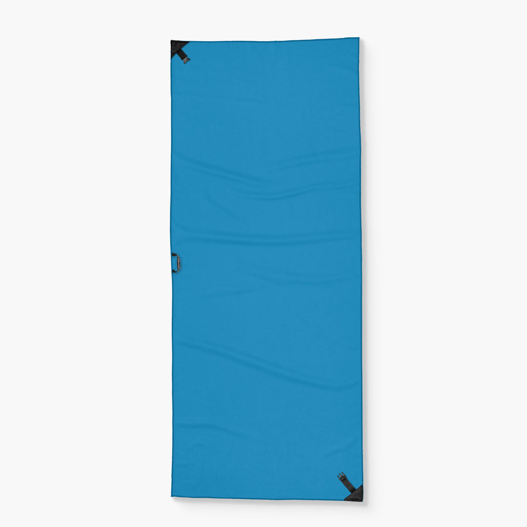Blue Tower Towel with black corner reinforcements, designed for easy storage and portability.