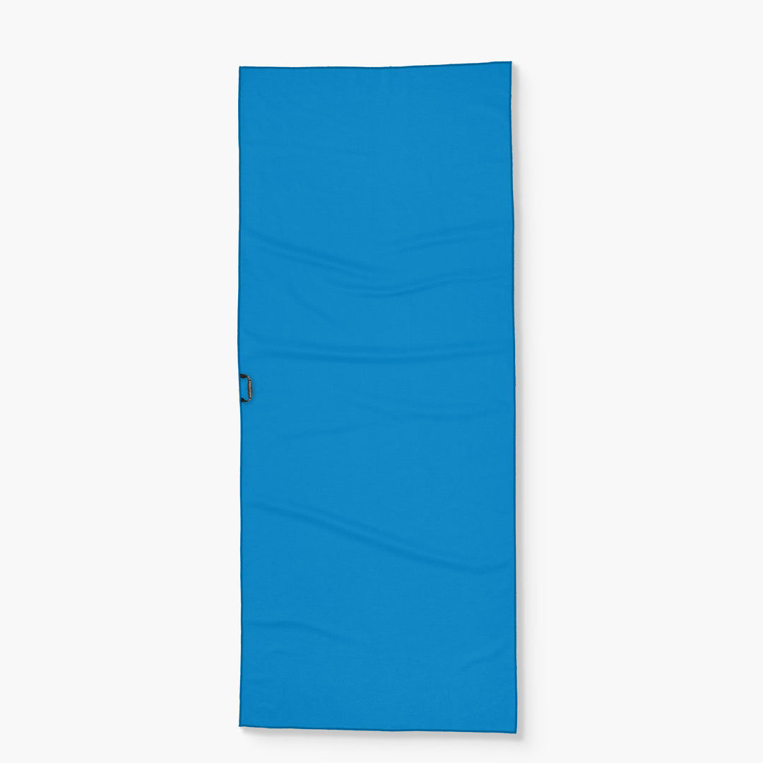Blue Wake Head - Sunset Oasis portable mattress with a handle, designed for outdoor relaxation and sunbathing.