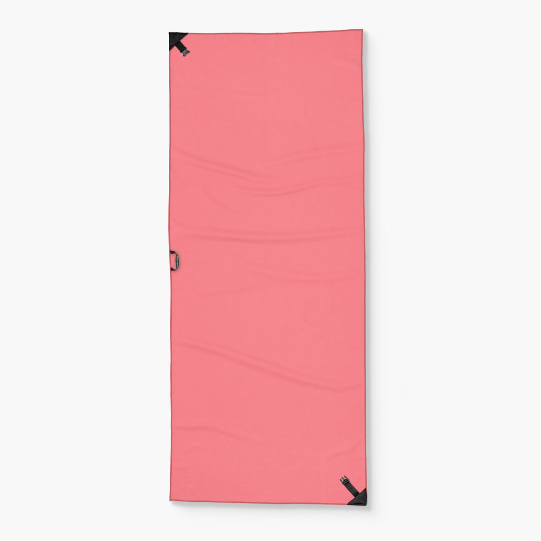 Pink Tower Towel with black corner loops and a side handle, designed for gym or outdoor use.