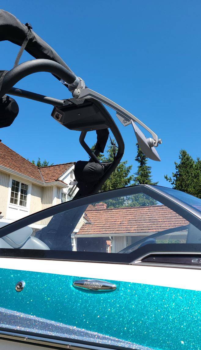 GV Tower Mirror Bracket mounted on a boat tower, showcasing its sleek design against a clear blue sky.