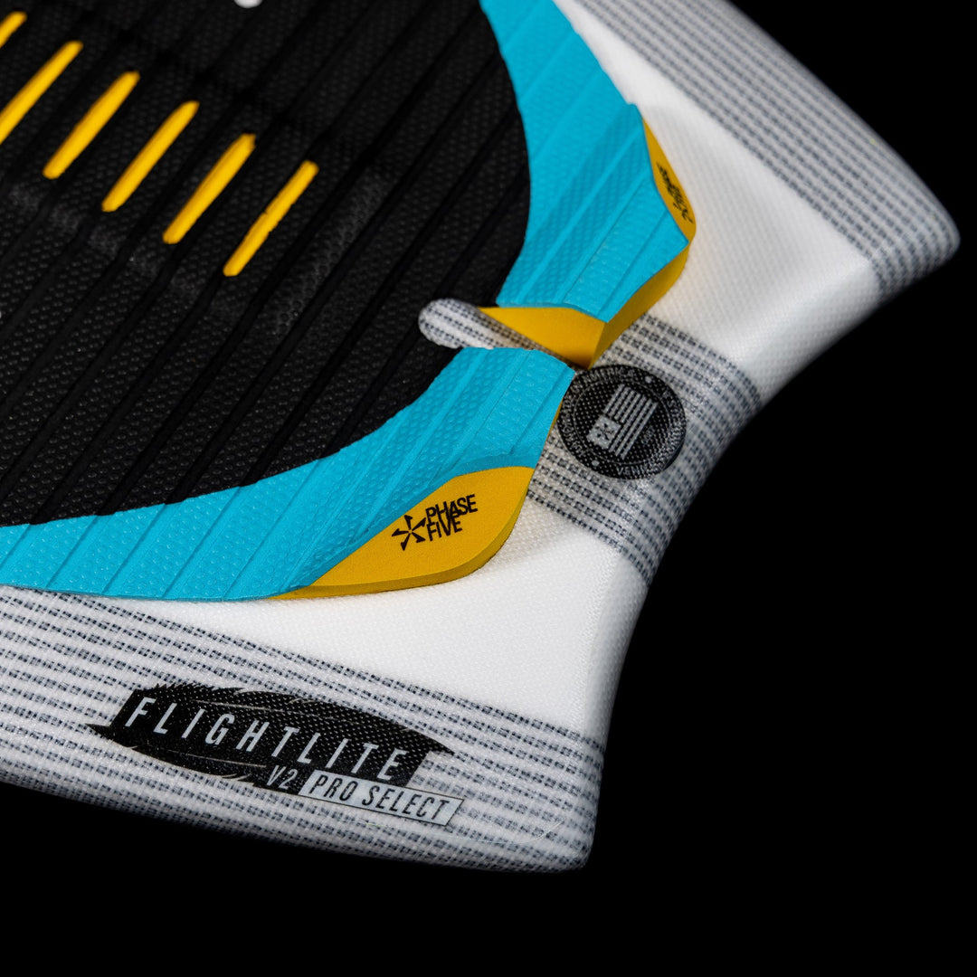 Close-up of the 2026 Phase Five Ahi surfboard featuring a textured surface, vibrant colors, and a sleek design for optimal performance.