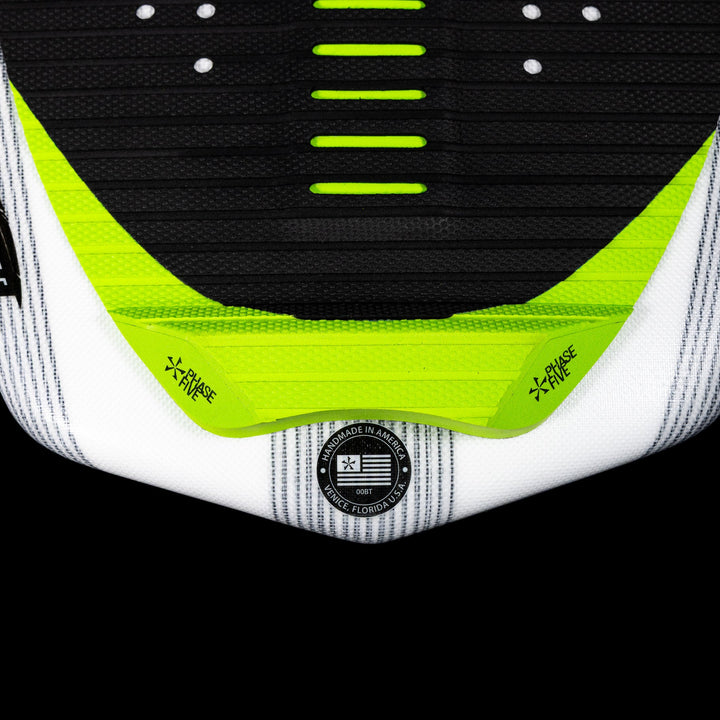 Close-up of the 2026 Phase Five Aku V2 wakeboard with a textured grip surface and vibrant green accents.