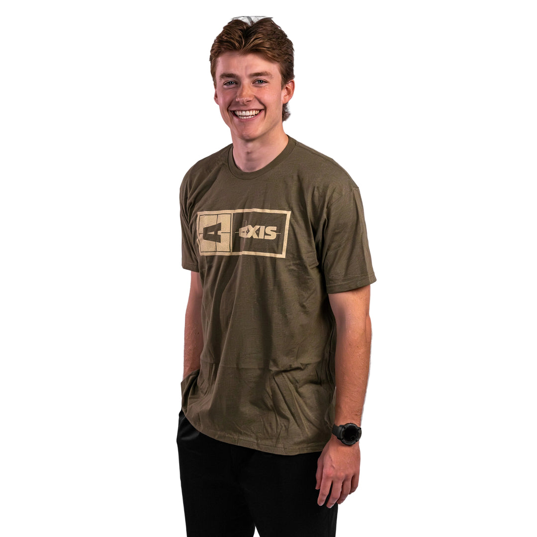 Axis Statement Tee in olive green, featuring a bold logo design, worn by a smiling young man. Perfect for casual outings.