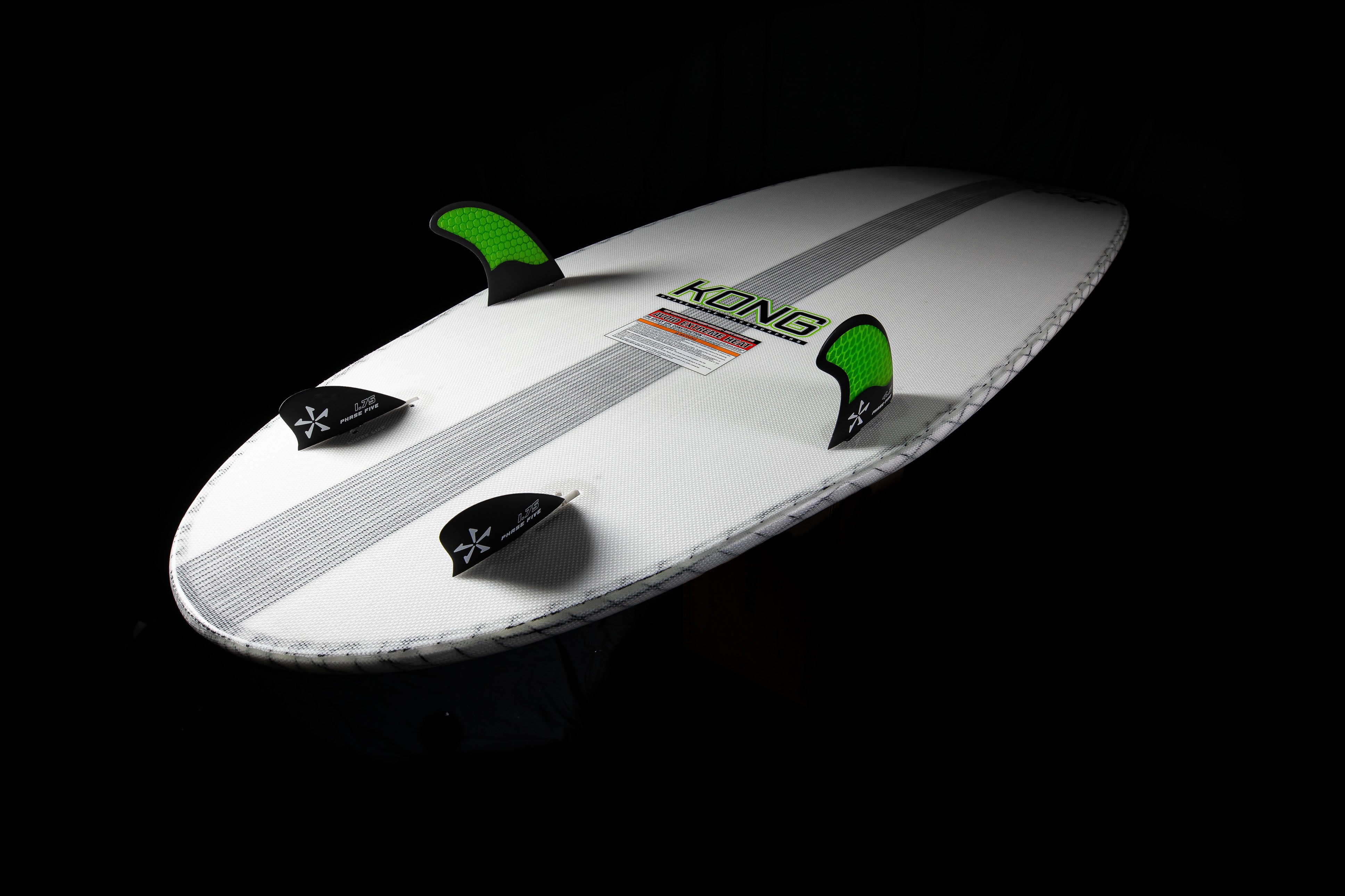 2025 Phase 5 Kong surfboard with white deck, black fins, and green traction pads, designed for high-performance surfing.