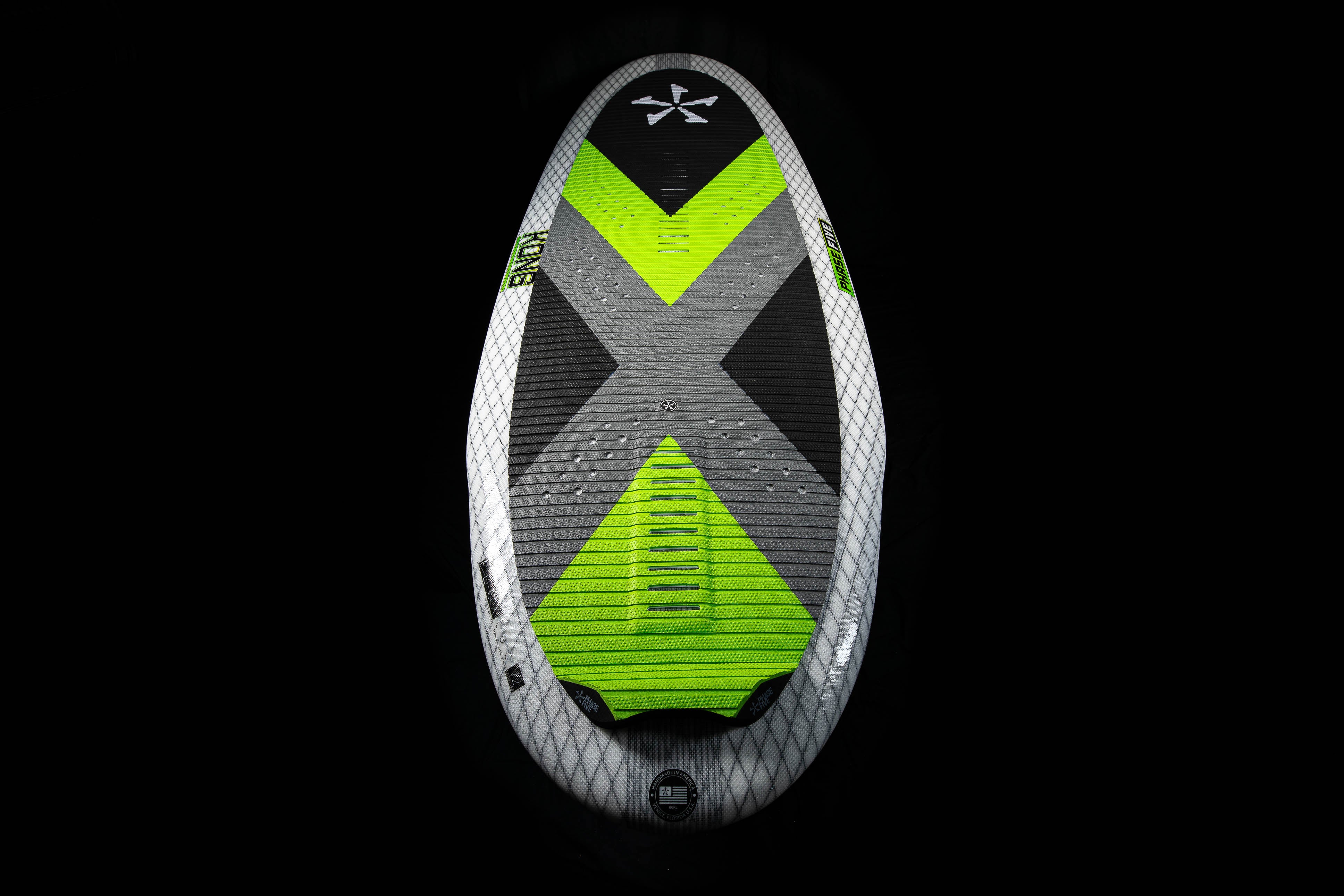 2025 Phase 5 Kong surfboard with a black, gray, white, and neon green design, shown against a black background.