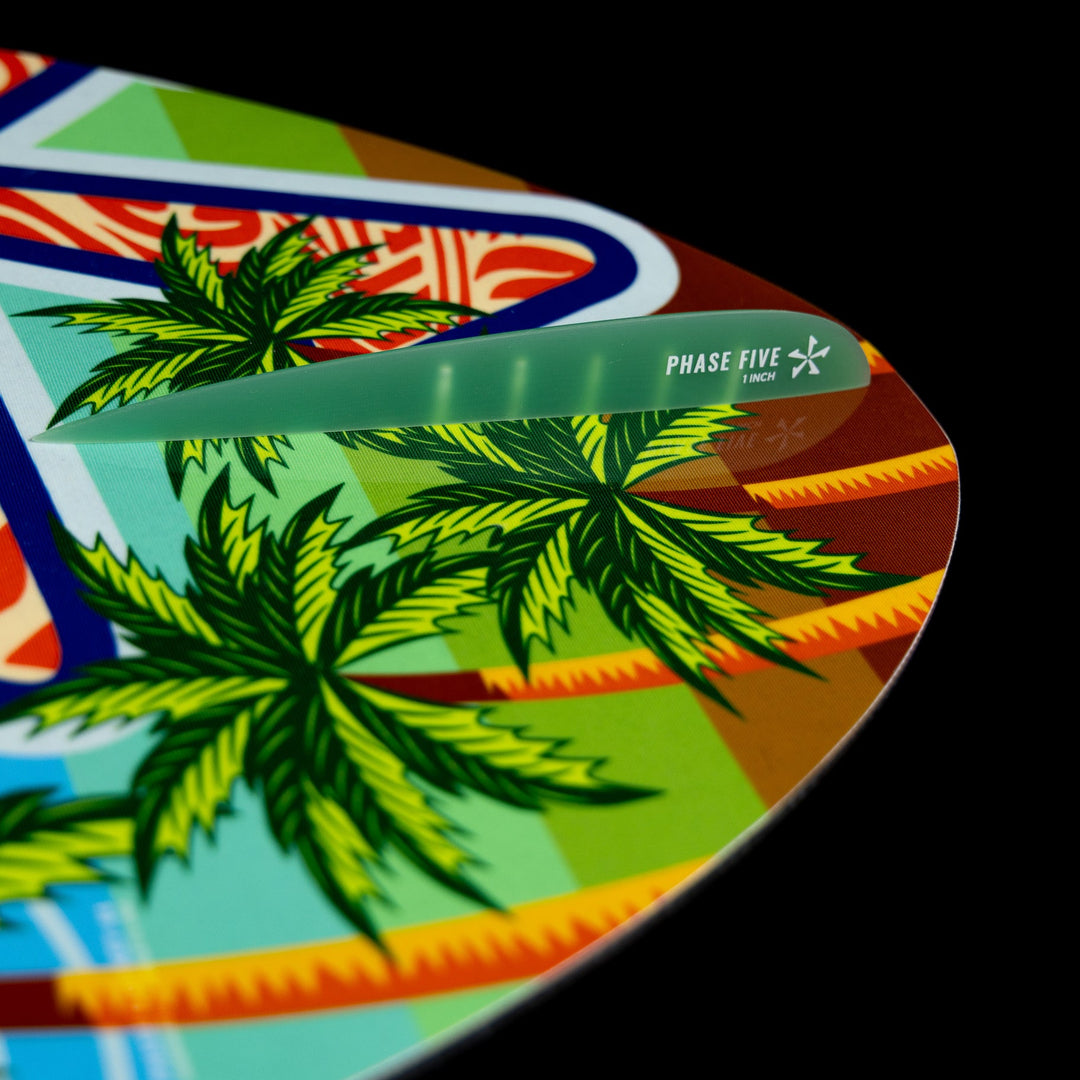 Close-up of the 2026 Phase Five Key Stewart Pro board featuring vibrant tropical graphics and a green fin.