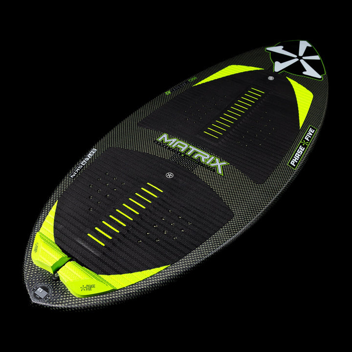 2026 Phase Five Matrix wakesurf board featuring a sleek design with a carbon finish and vibrant yellow accents.