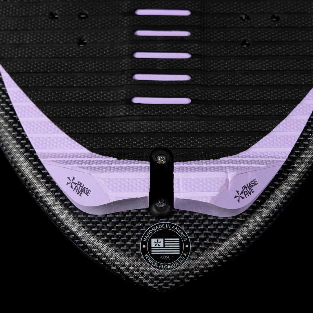 Close-up of the 2026 Phase Five Mindset wake surfboard featuring a textured surface and adjustable fins for optimal performance.