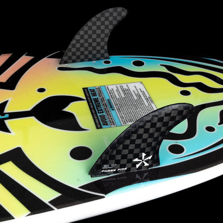 2026 Phase Five Minnow surfboard featuring vibrant graphics and carbon fins for enhanced performance on the water.