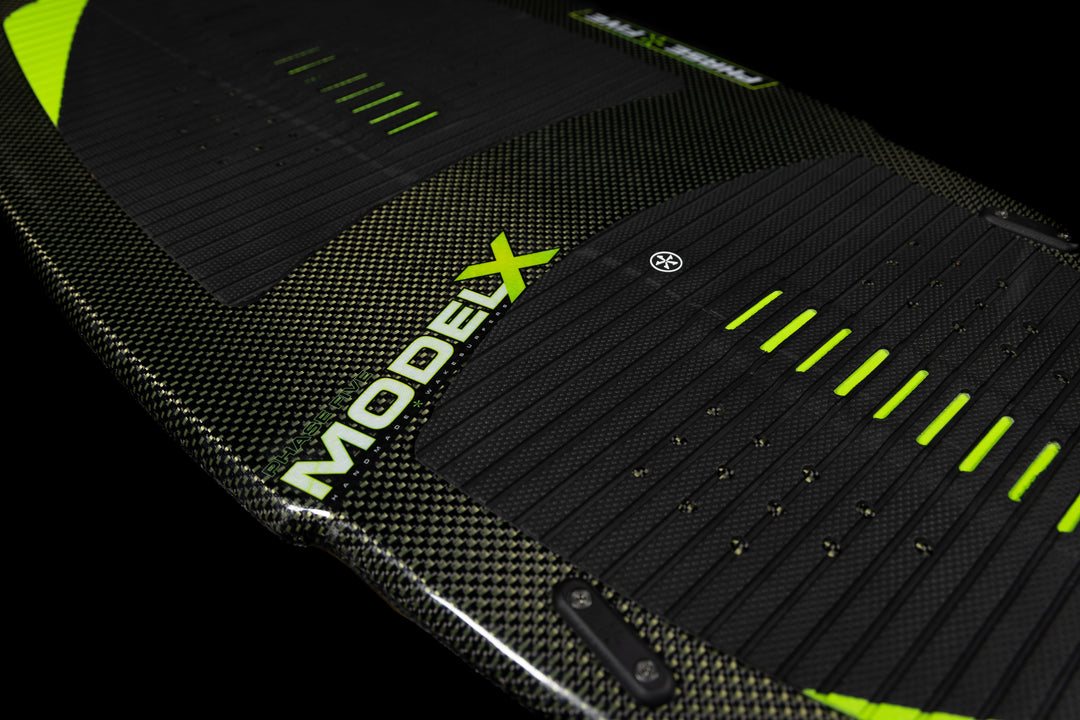 2025 Phase 5 Model X Skim Board featuring a textured surface and vibrant green accents for enhanced grip and performance.