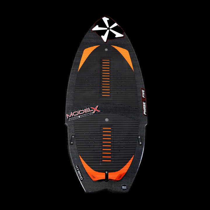 2026 Phase Five Model X wakesurf board featuring a sleek black design with orange accents and textured footpads.
