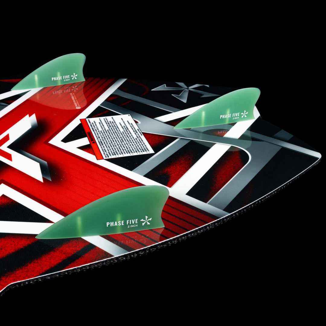 2026 Phase Five Model X wake surfboard featuring a vibrant design and three fins for enhanced performance on the water.