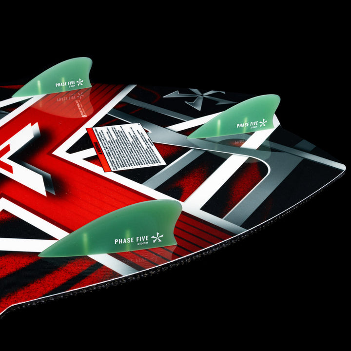 2026 Phase Five Model X wake surfboard featuring a vibrant design and three fins for enhanced performance on the water.