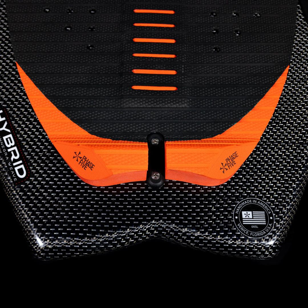 Close-up of the 2026 Phase Five Model X wake surfboard showcasing its textured surface and vibrant orange accents.