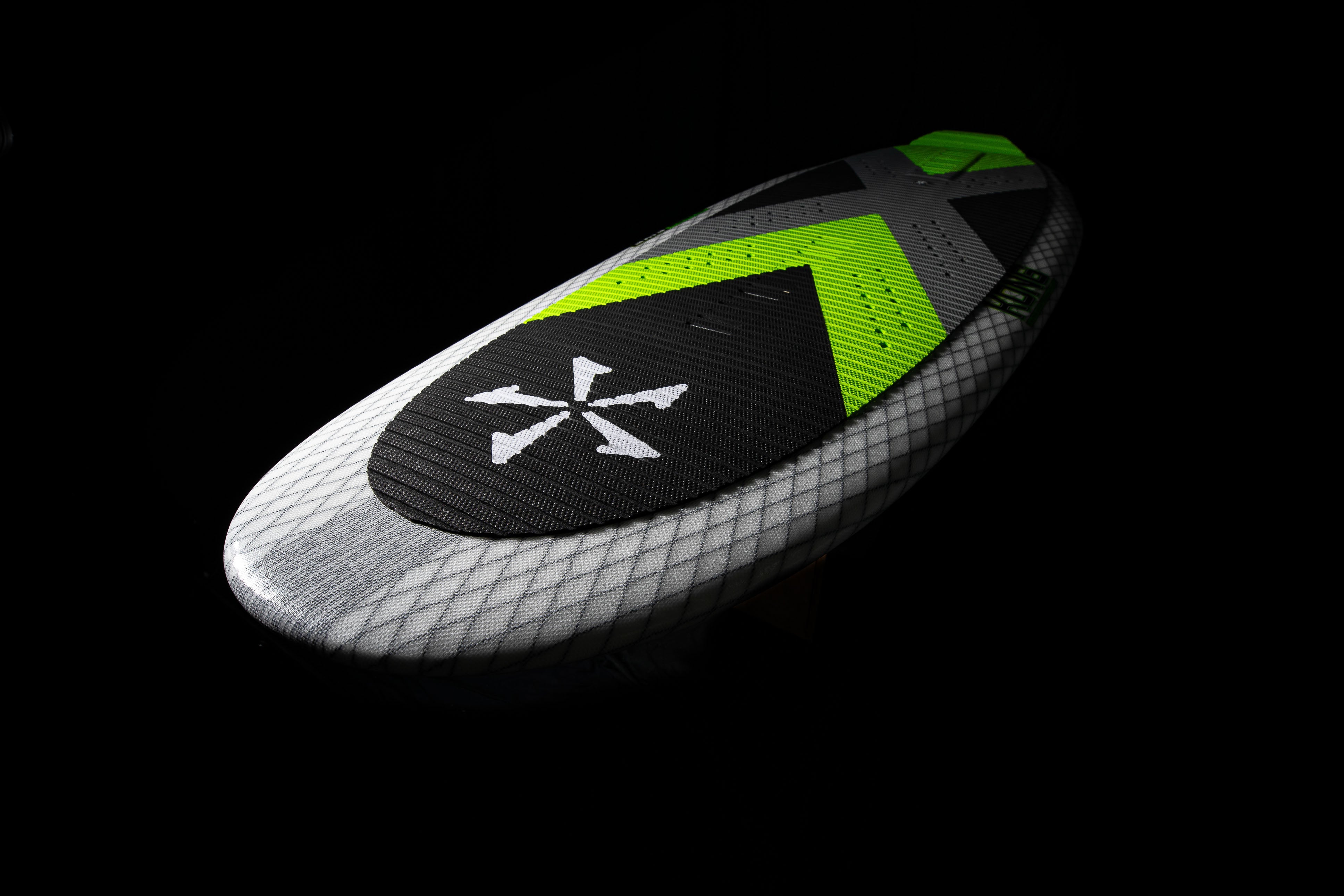 2025 Phase 5 Kong surfboard with a sleek black, white, and neon green design, featuring textured grip pad and modern shape.
