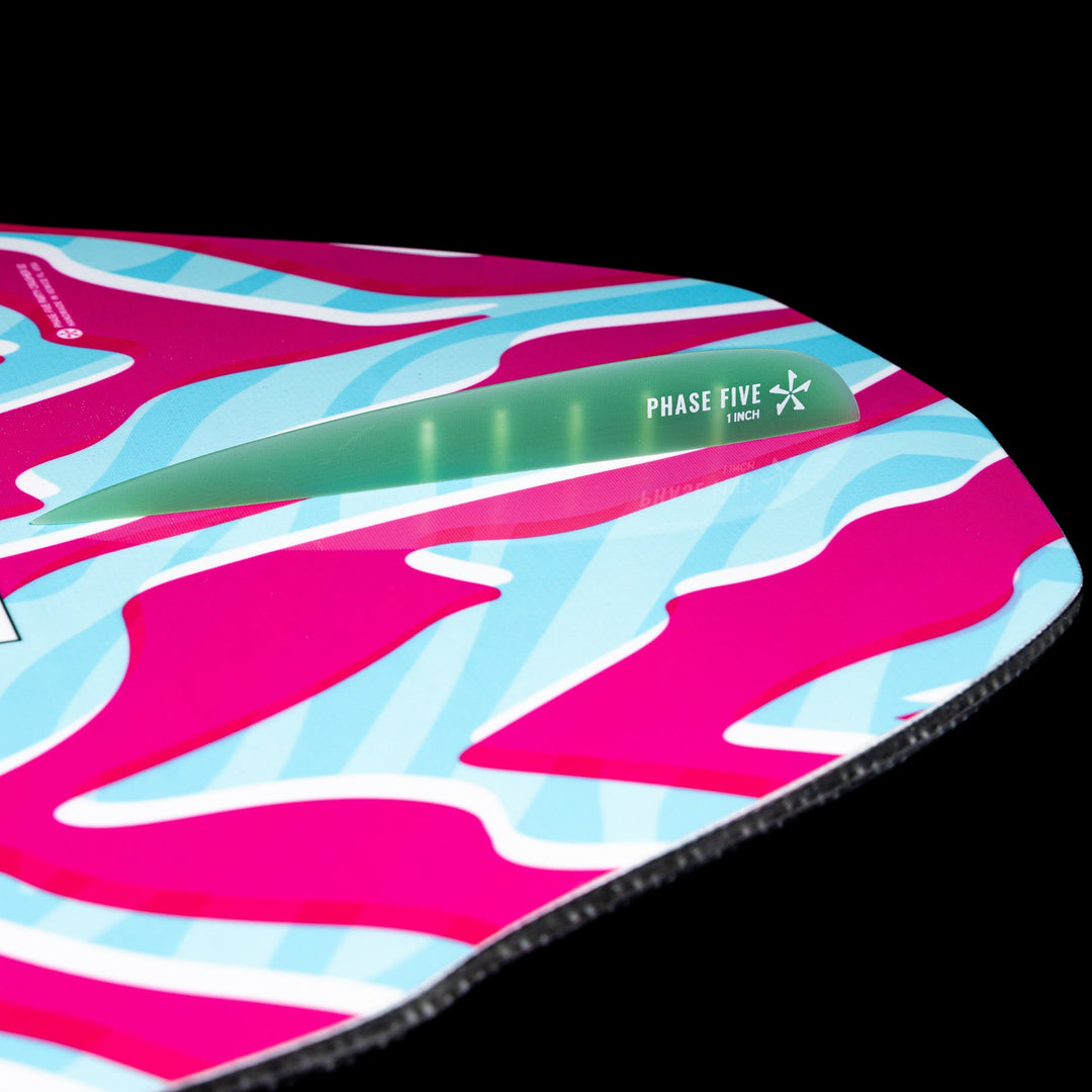 2026 Phase Five Party Crasher wake surfboard featuring vibrant pink and blue design with a green fin.