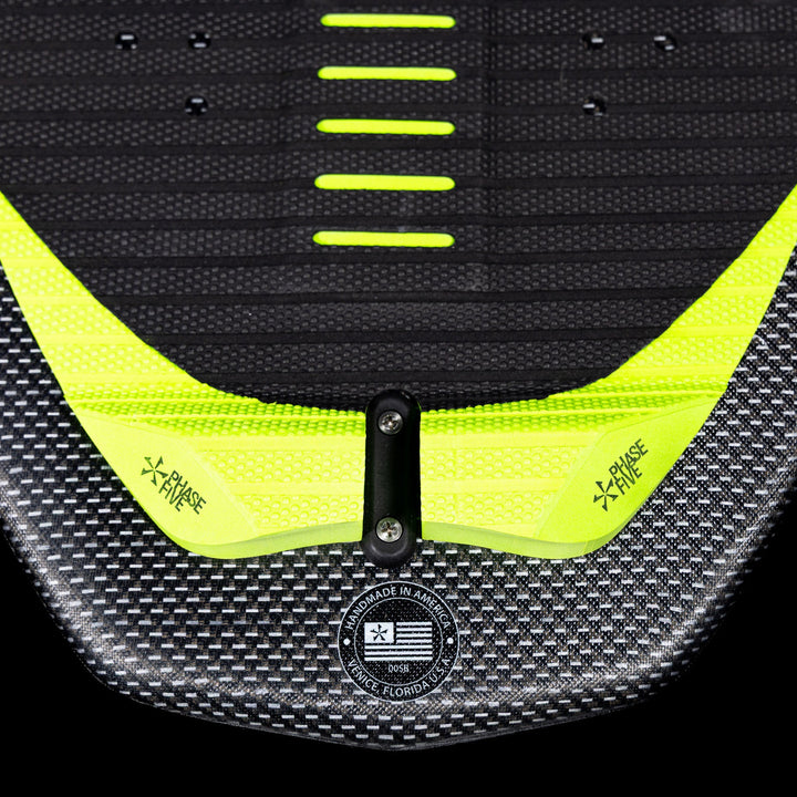 Close-up of the 2026 Phase Five Party Crasher wake surfboard featuring a textured surface and vibrant yellow accents.