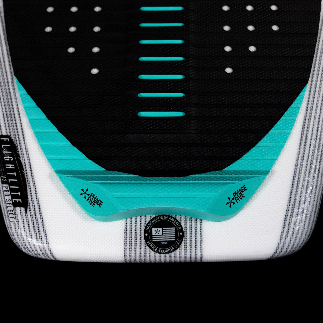 Close-up of the 2026 Phase Five Phantom wakeboard with a textured surface and vibrant turquoise accents.
