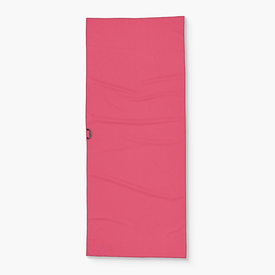 Pink Wake Head Berry Sweet Lake towel with a handle on the side, ideal for beach or pool use.