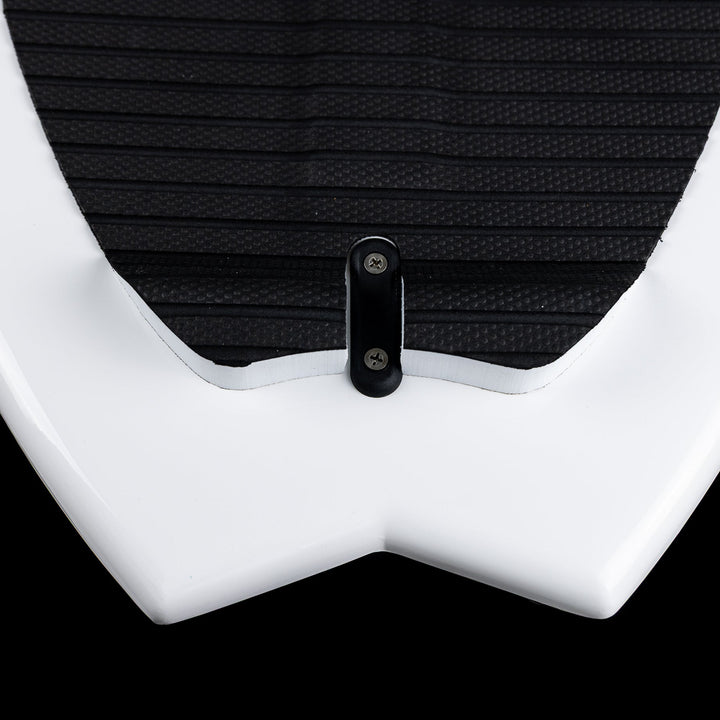 Close-up of the 2026 Phase Five Surfari surfboard showing the sleek white design and textured black traction pad.