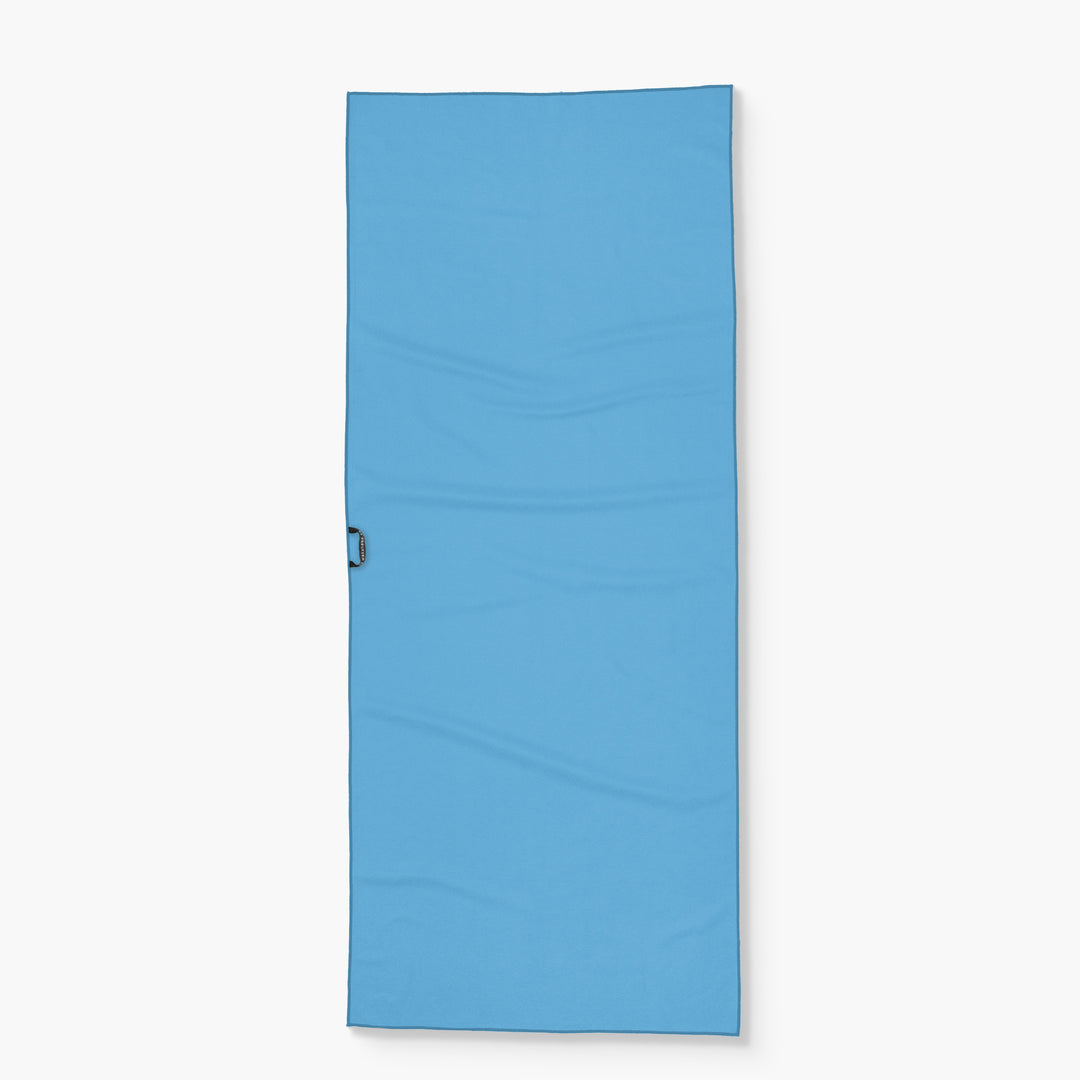 Blue Tide Chaser Lake Towel with a black handle loop on the side, designed for beach or lake use.